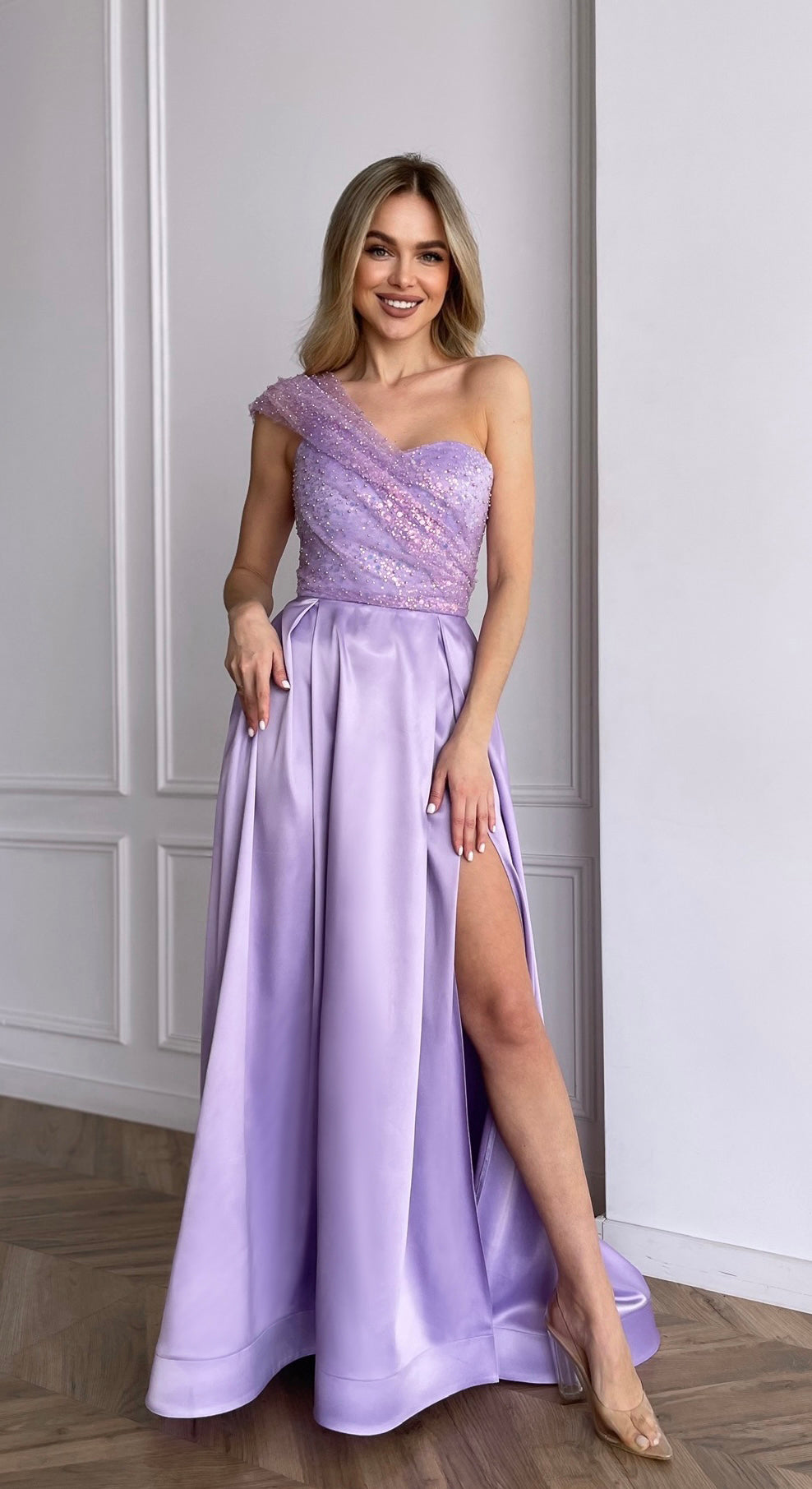 Lavender corset dress with one-shoulder sequin mesh draping and pleated satin maxi skirt by GLOWSYOU